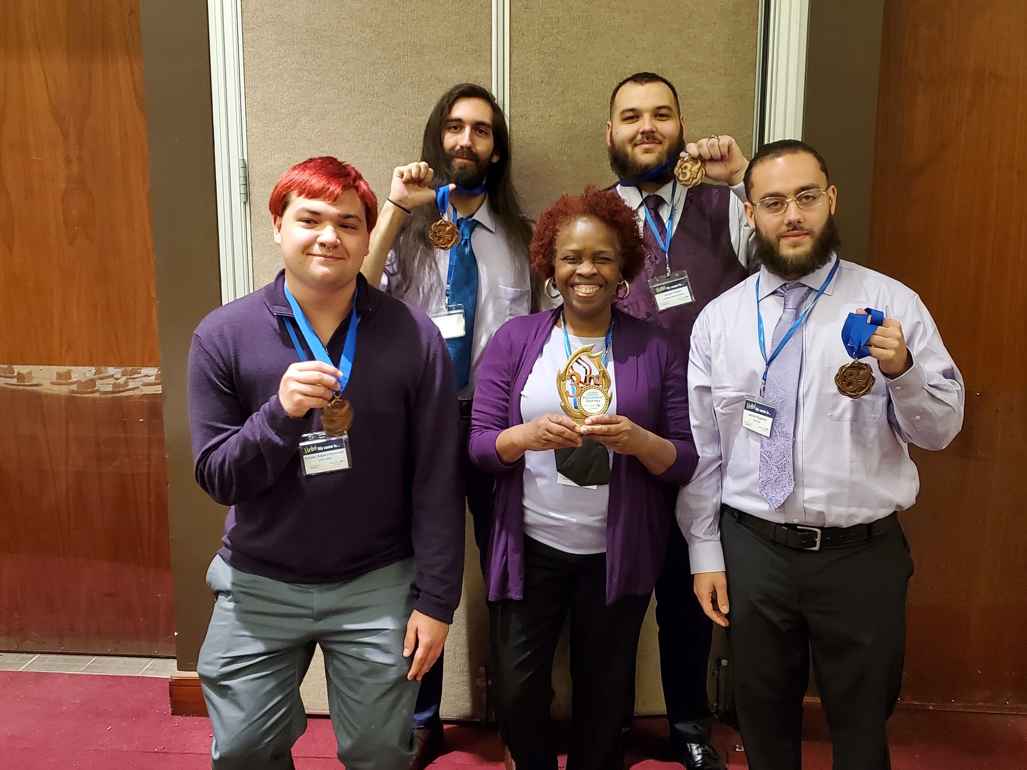 Students and teacher pose with award ribbons, April 29th, 2022 - Jobs for Michigan Graduation